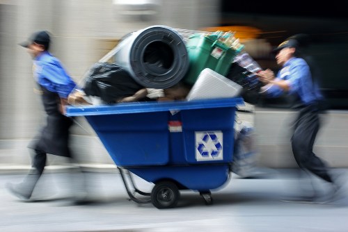 Crew loading a medium-sized truck with garden and home waste